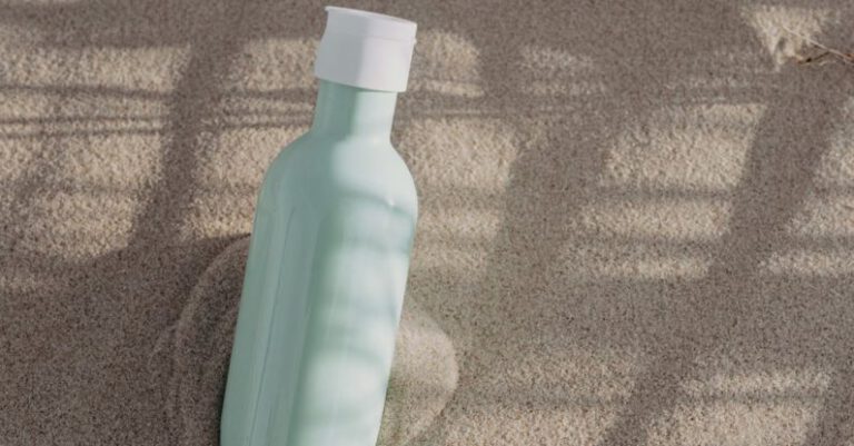 Mangroves - Green and White Plastic Bottle on Sand