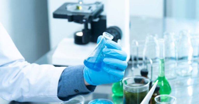 Scientists - Person Holding Laboratory Flask