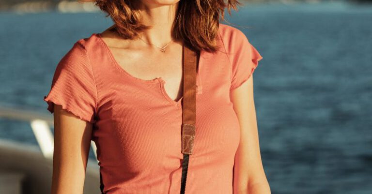 Coasts - Portrait of Smiling Woman on Vessel on Sea